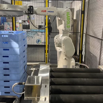 Harold the Robot in action unloading crates from a washer